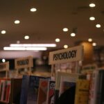 a row of books on a shelf in a library